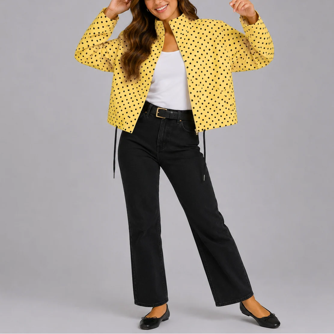 Full-length view of polka dot bomber jacket showing relaxed silhouette and adjustable hem