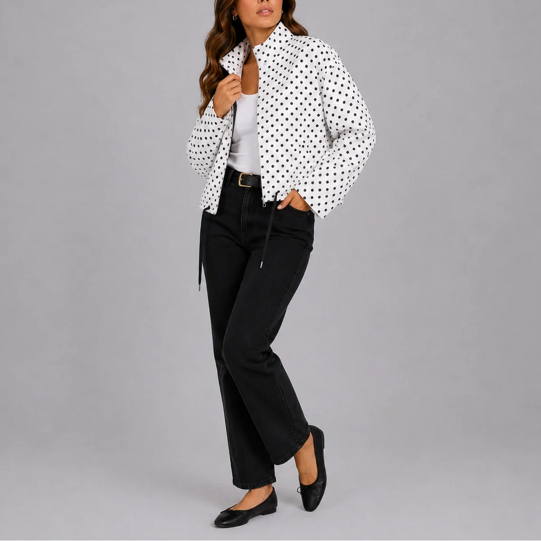 Back view of polka dot bomber jacket displaying all-over pattern and comfortable fit