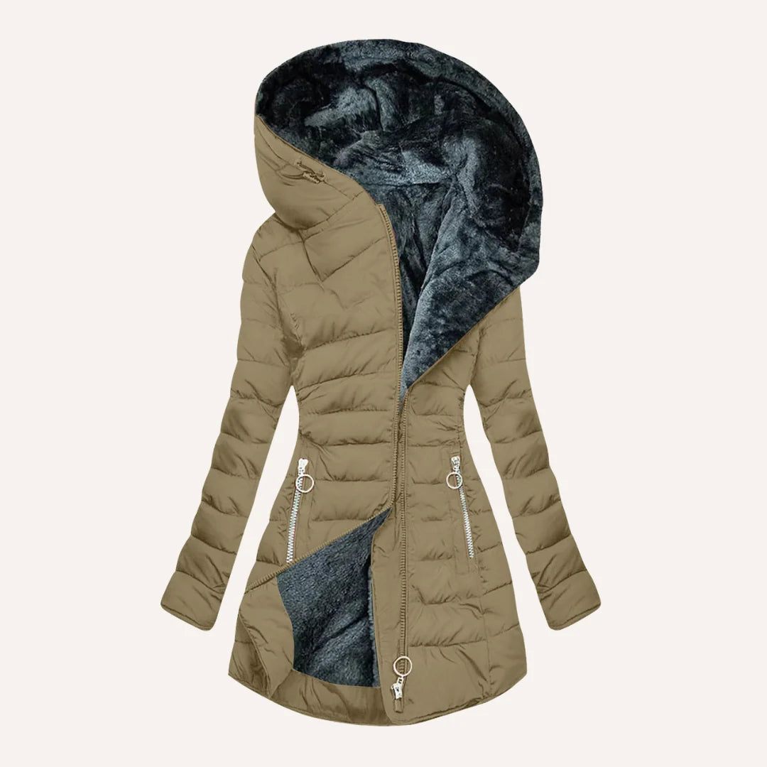 Women's quilted puffer jacket detail showing ribbed cuffs and insulated construction