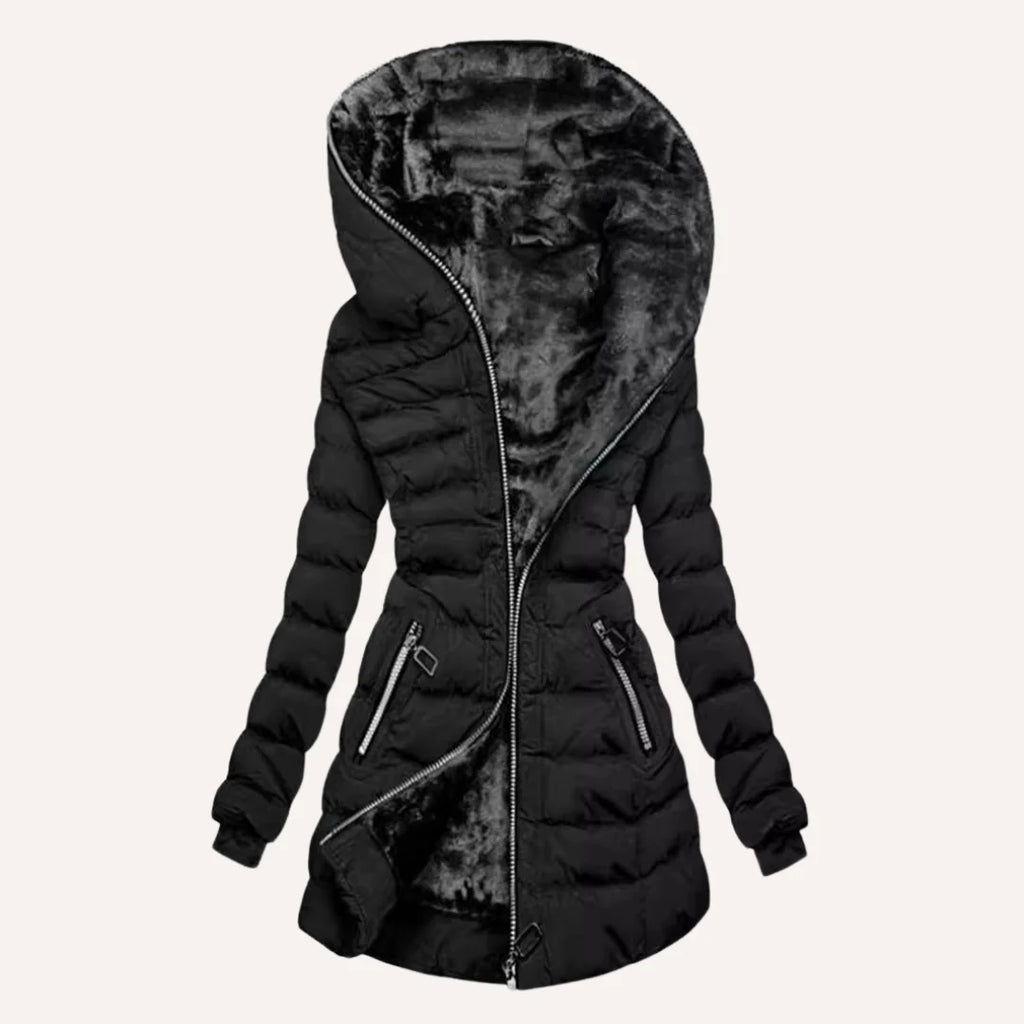 Close-up view of women's quilted puffer jacket showing structured quilting and fleece lining detail