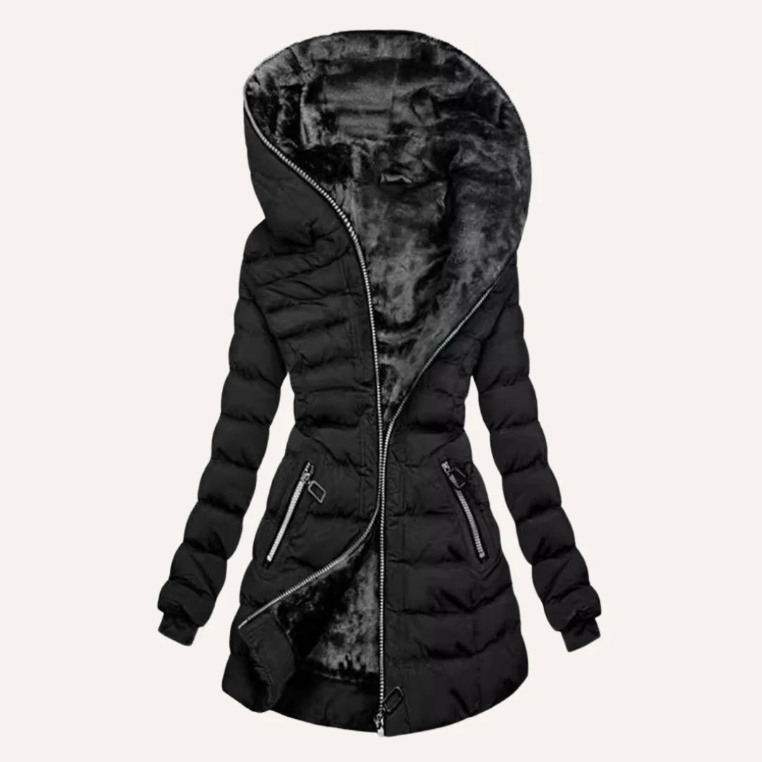 Close-up view of women's quilted puffer jacket showing structured quilting and fleece lining detail