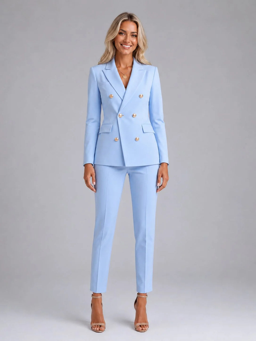 Women's tailored blazer trouser suit set in light blue with double-breasted gold buttons and slim-leg trousers