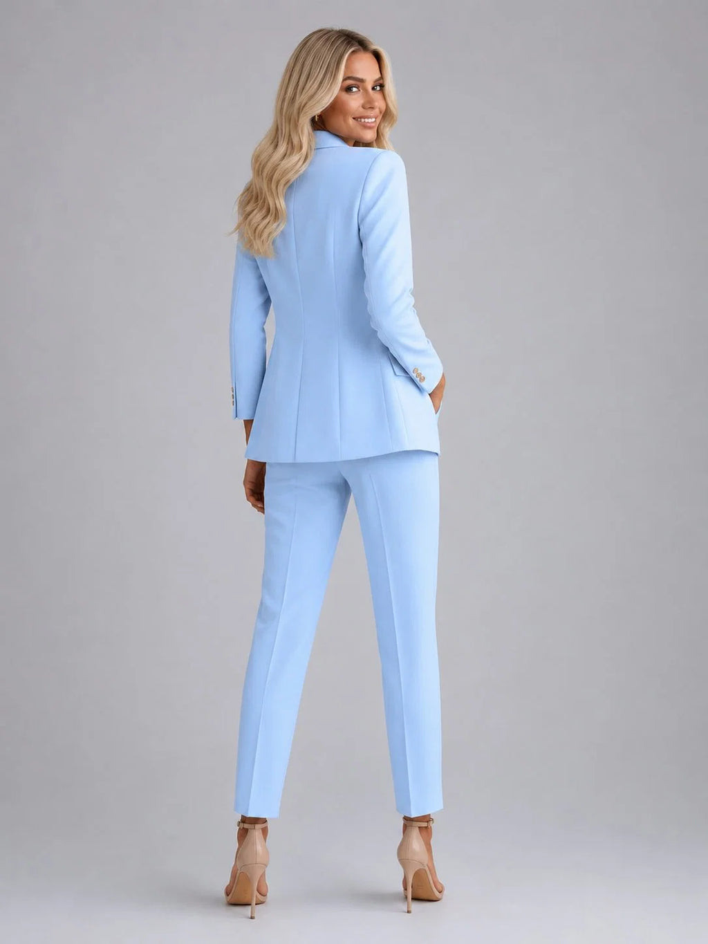Double-breasted blazer with gold-tone buttons and notched lapels paired with slim-fit ankle-length trousers