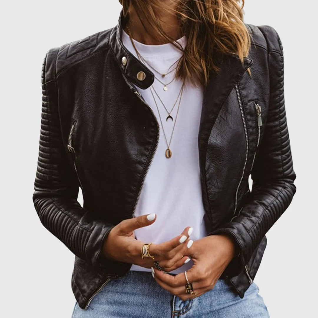 Women's biker jacket with quilted sleeves and asymmetric zip worn over white tee and jeans