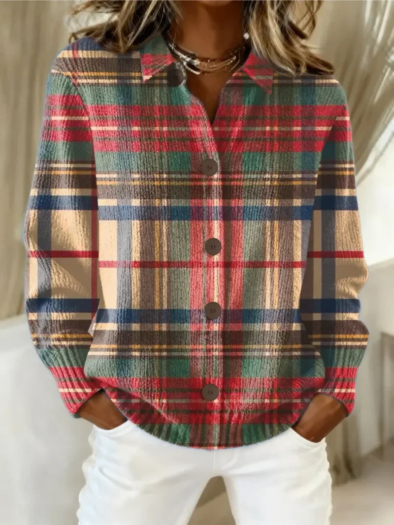 Women's checked knit shirt in multicoloured tartan pattern with red, green, beige, and blue tones, featuring collared neckline and button-front closure