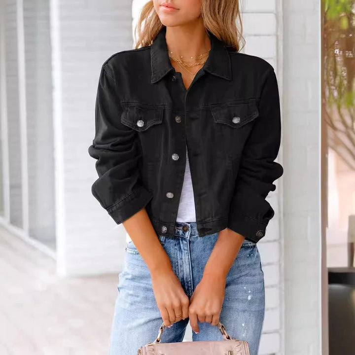Back view of women's cropped denim jacket in pink, showing waist-length hem and relaxed silhouette