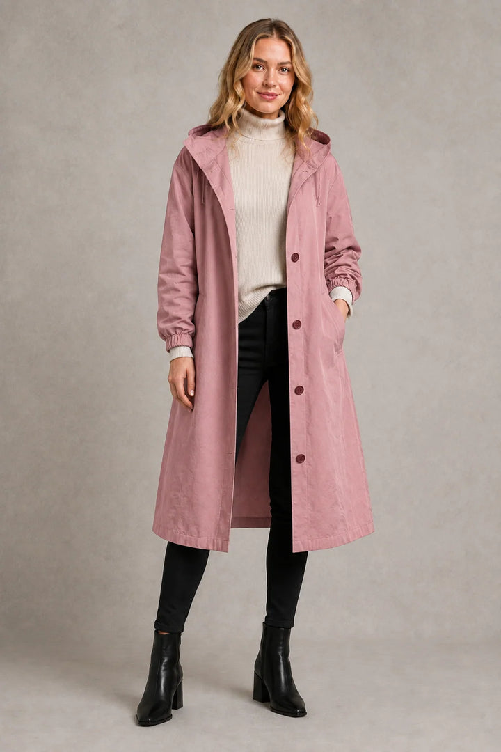 Full-length view of oversized trench coat with hood and practical weather protection features