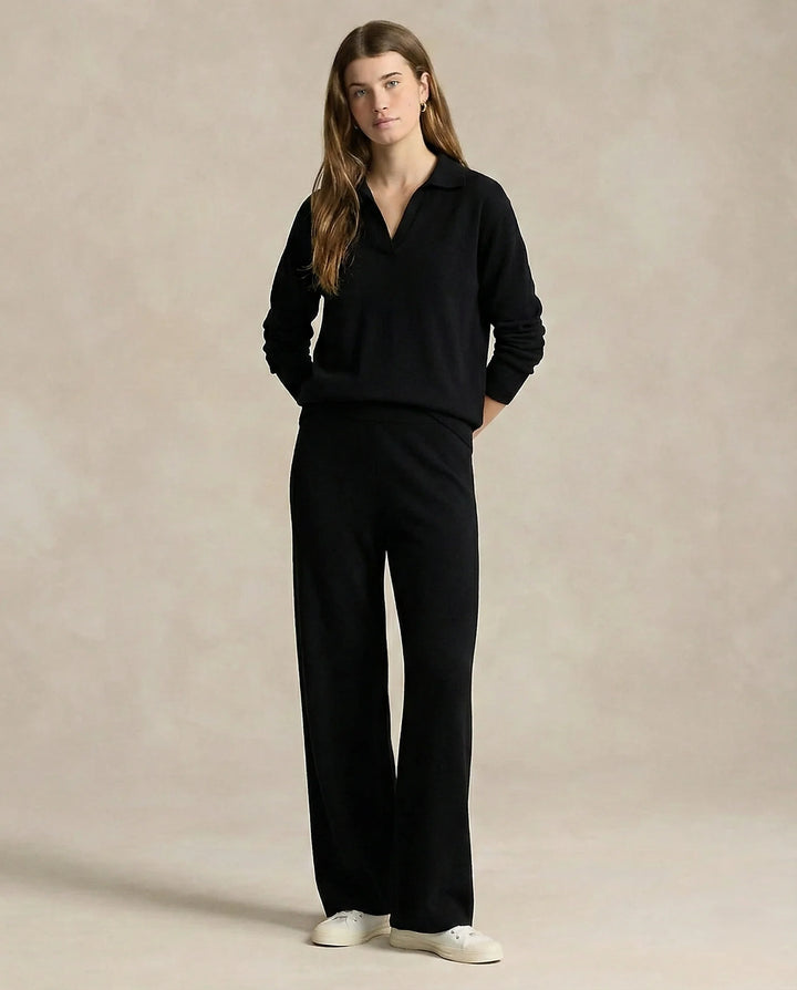Woman wearing beige Merino lounge set showing relaxed silhouette and high-waisted trousers
