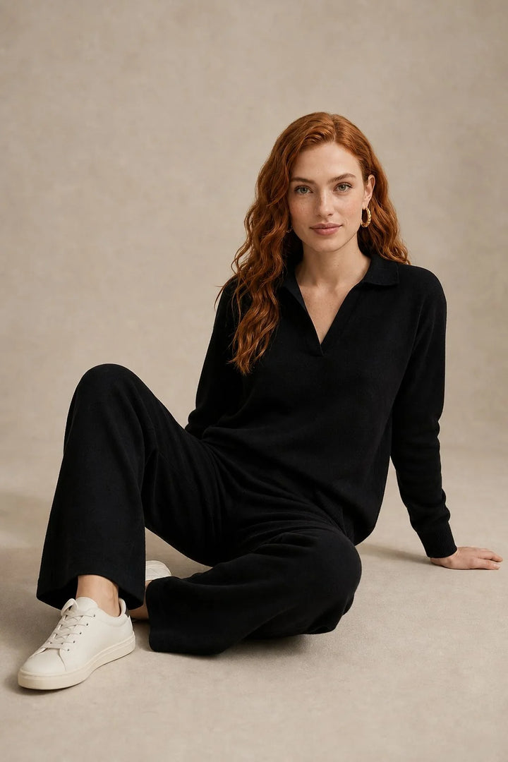 Woman standing in beige Merino lounge set showing tapered trousers and relaxed jumper fit