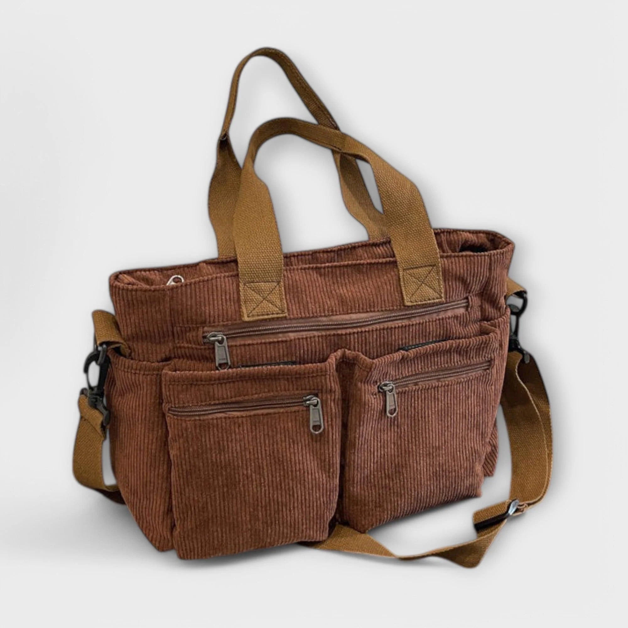 Detail of dual top handles and corduroy fabric on women's tote bag
