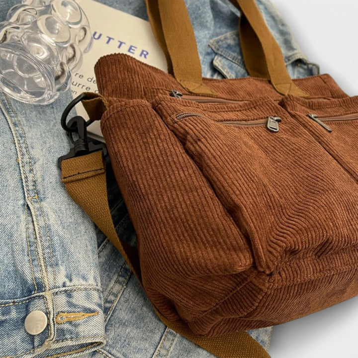 Women's corduroy tote bag flat lay showing spacious main compartment and organisational features