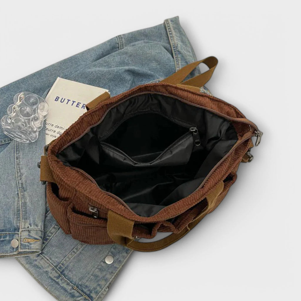 Rear view of corduroy tote bag showing slip pocket and shoulder strap attachment