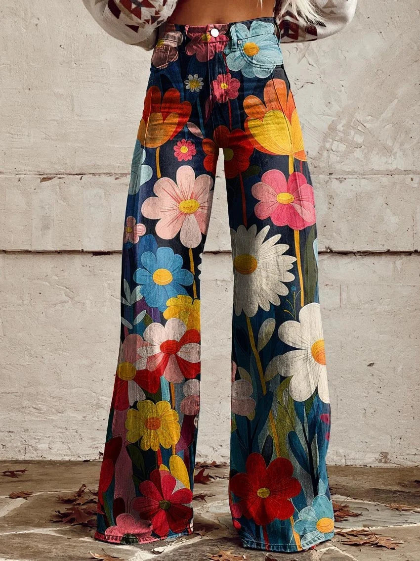 Women's wide-leg trousers with bold multicolour floral print on navy base and high-waist design
