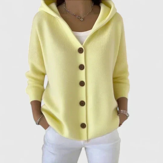 Close-up of soft knit hooded cardigan with button detail and long sleeves