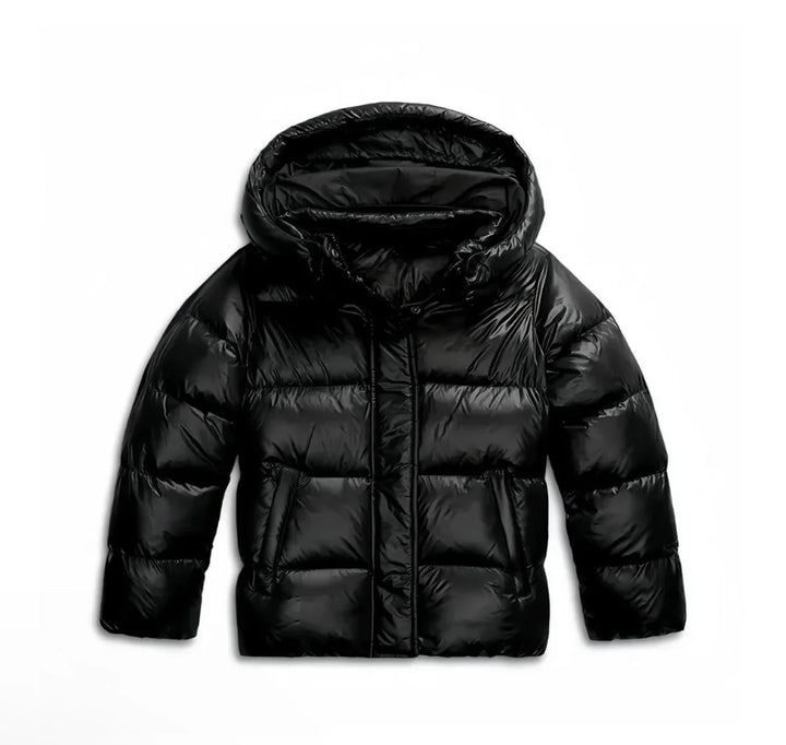 Detail of women's hooded puffer jacket glossy fabric and quilted panels