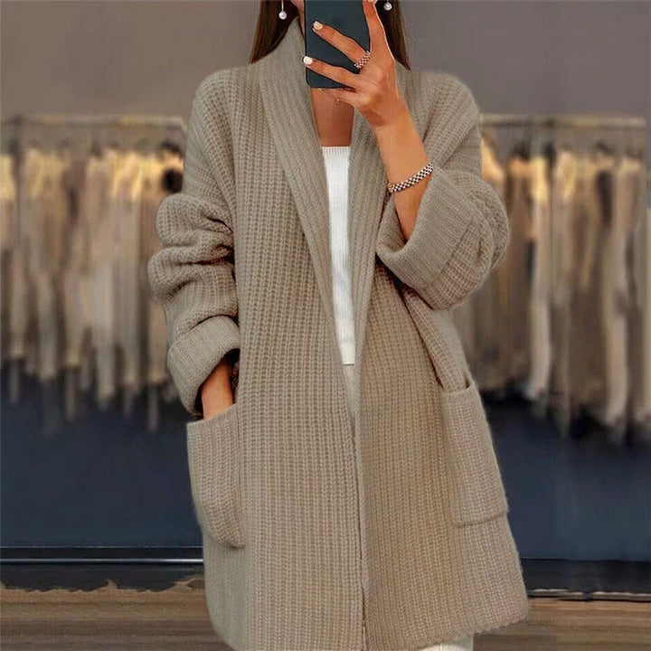 Full-length view of oversized cardigan paired with fitted top showing relaxed drape