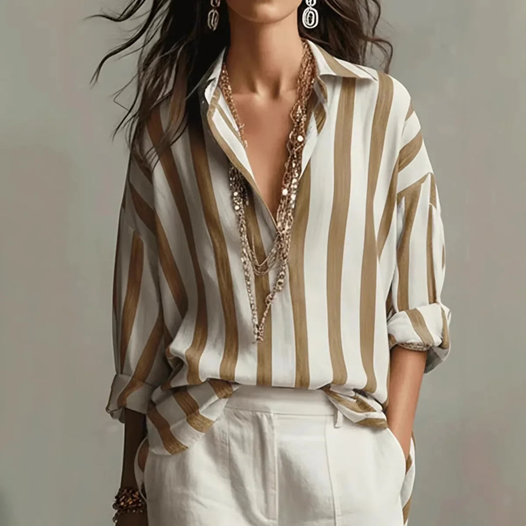 Close-up view of vertical stripe pattern on women's linen shirt with collared neckline