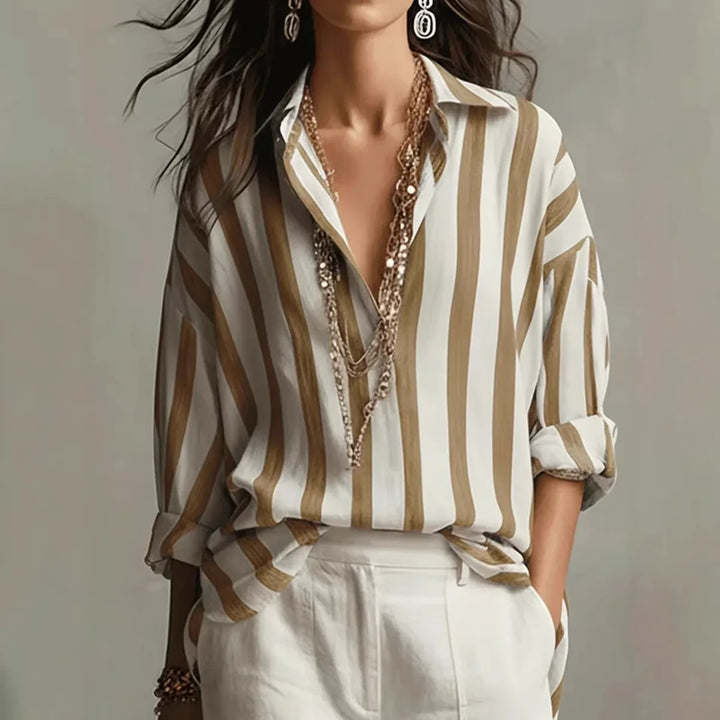 Close-up view of vertical stripe pattern on women's linen shirt with collared neckline