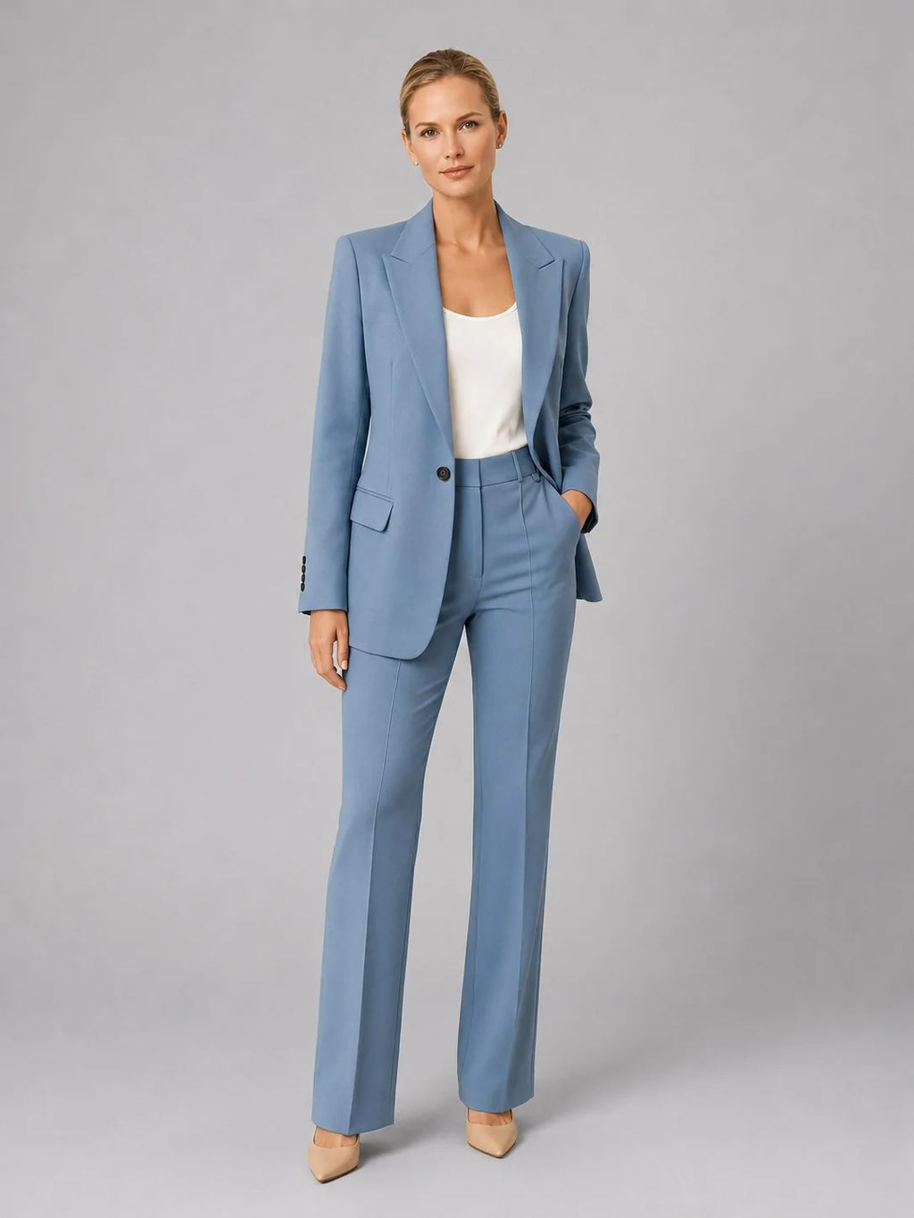 Women's tailored suit set in pale blue with single-breasted blazer and high-waist straight-leg trousers on model