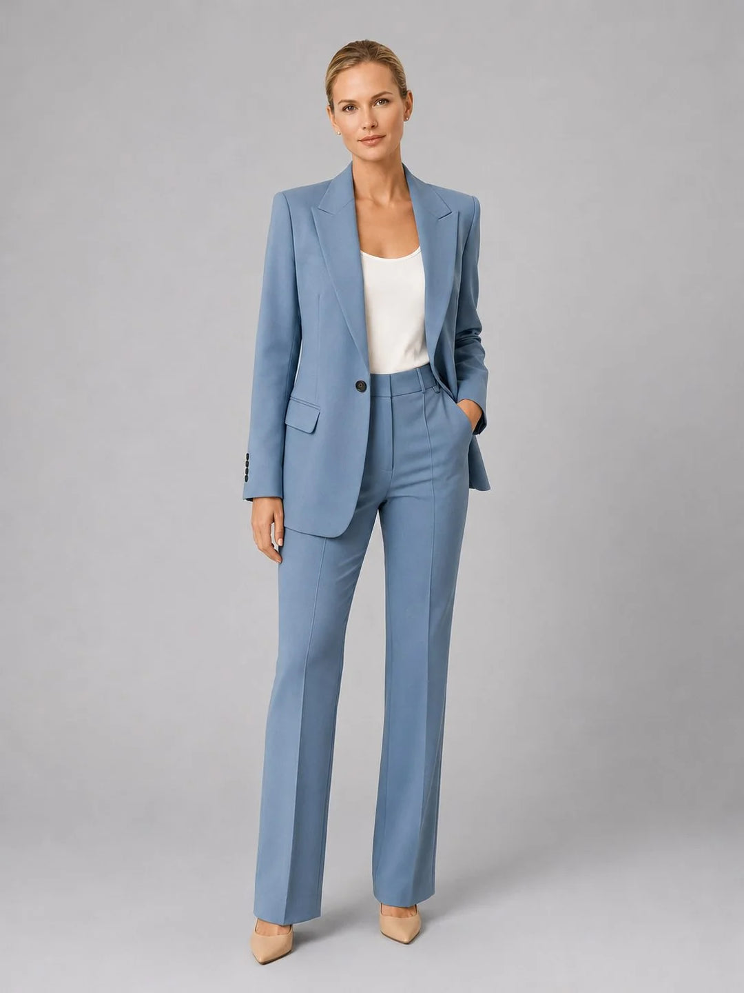 Women's tailored suit set in pale blue with single-breasted blazer and high-waist straight-leg trousers on model