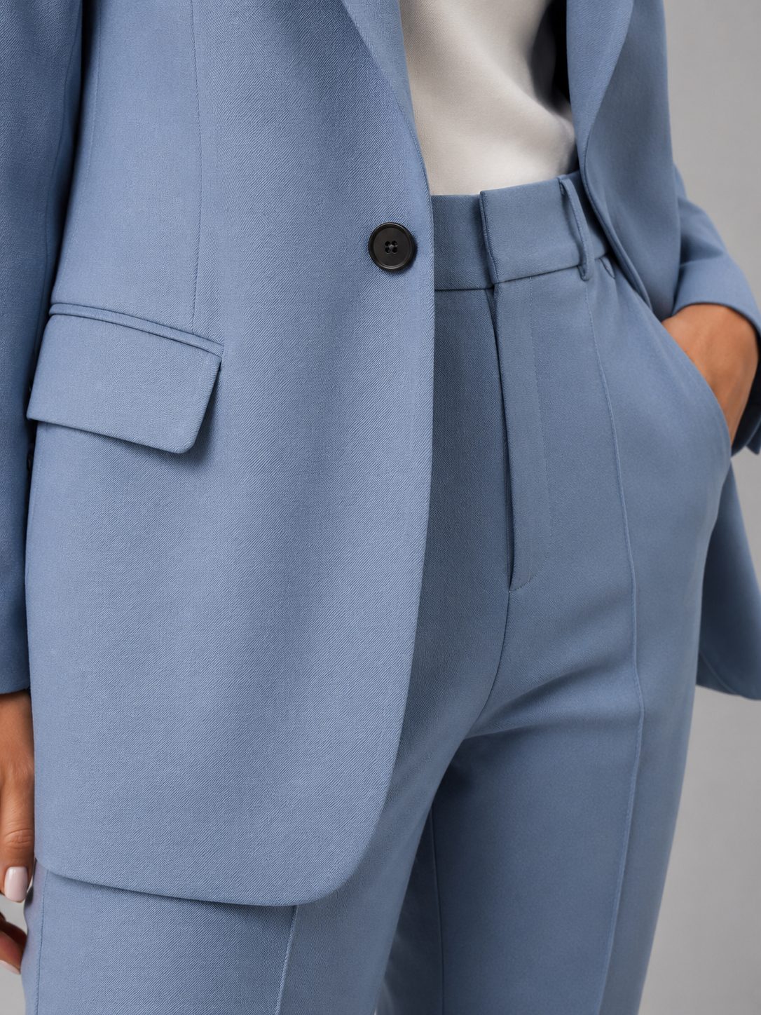 Front view of women's tailored suit set showing notch lapel blazer and matching high-waist trousers