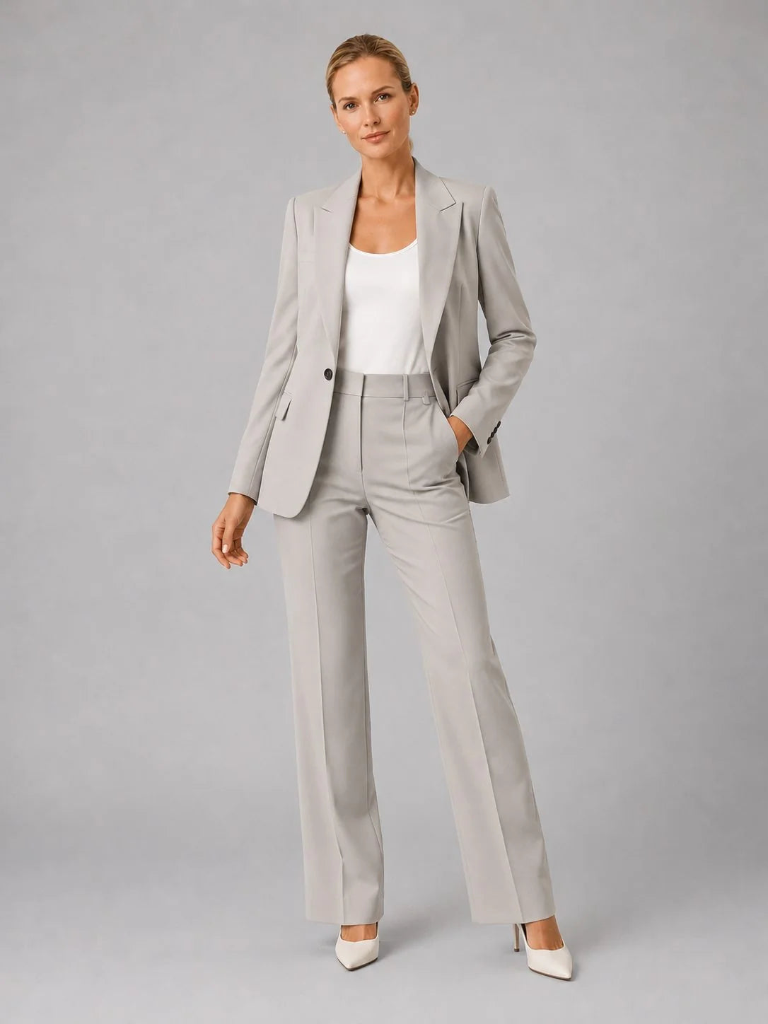 Close-up detail of women's tailored suit set blazer showing single-button closure and notch lapel