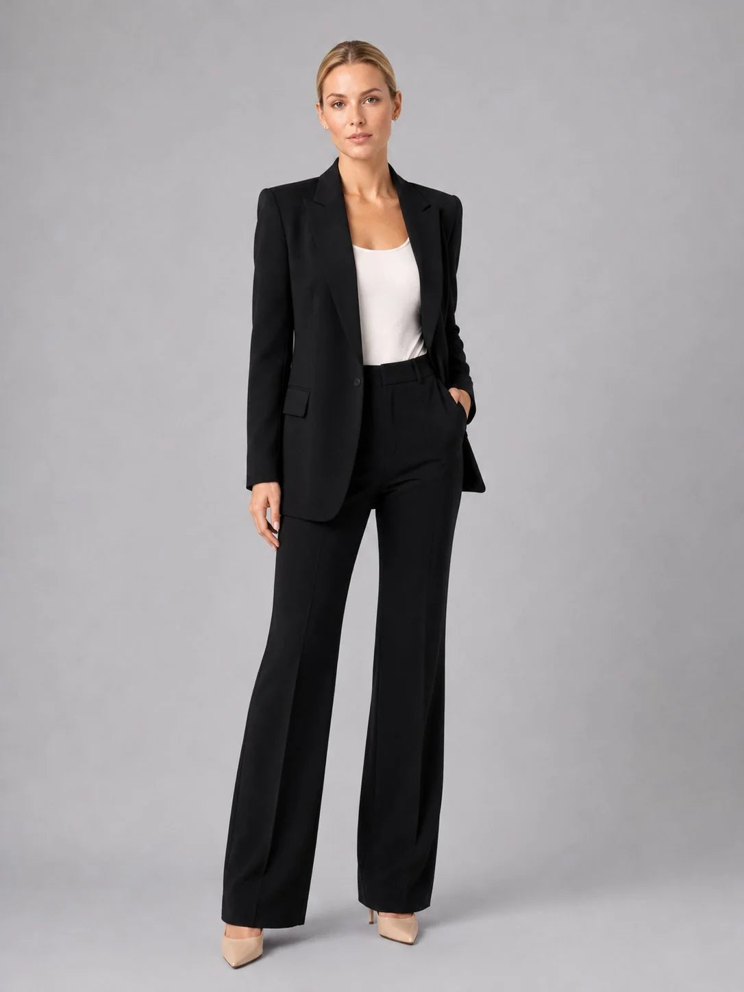 Women's tailored suit set showing high-waist trouser fit and straight-leg cut to ankle