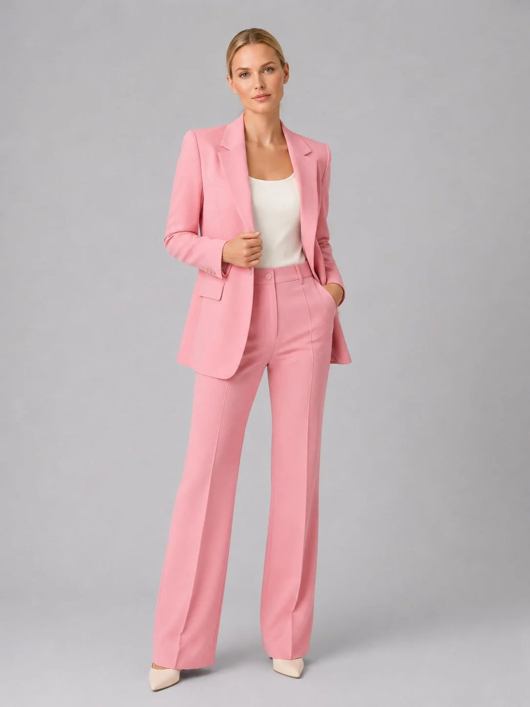 Women's tailored suit set styled for office wear with neutral heels and simple top