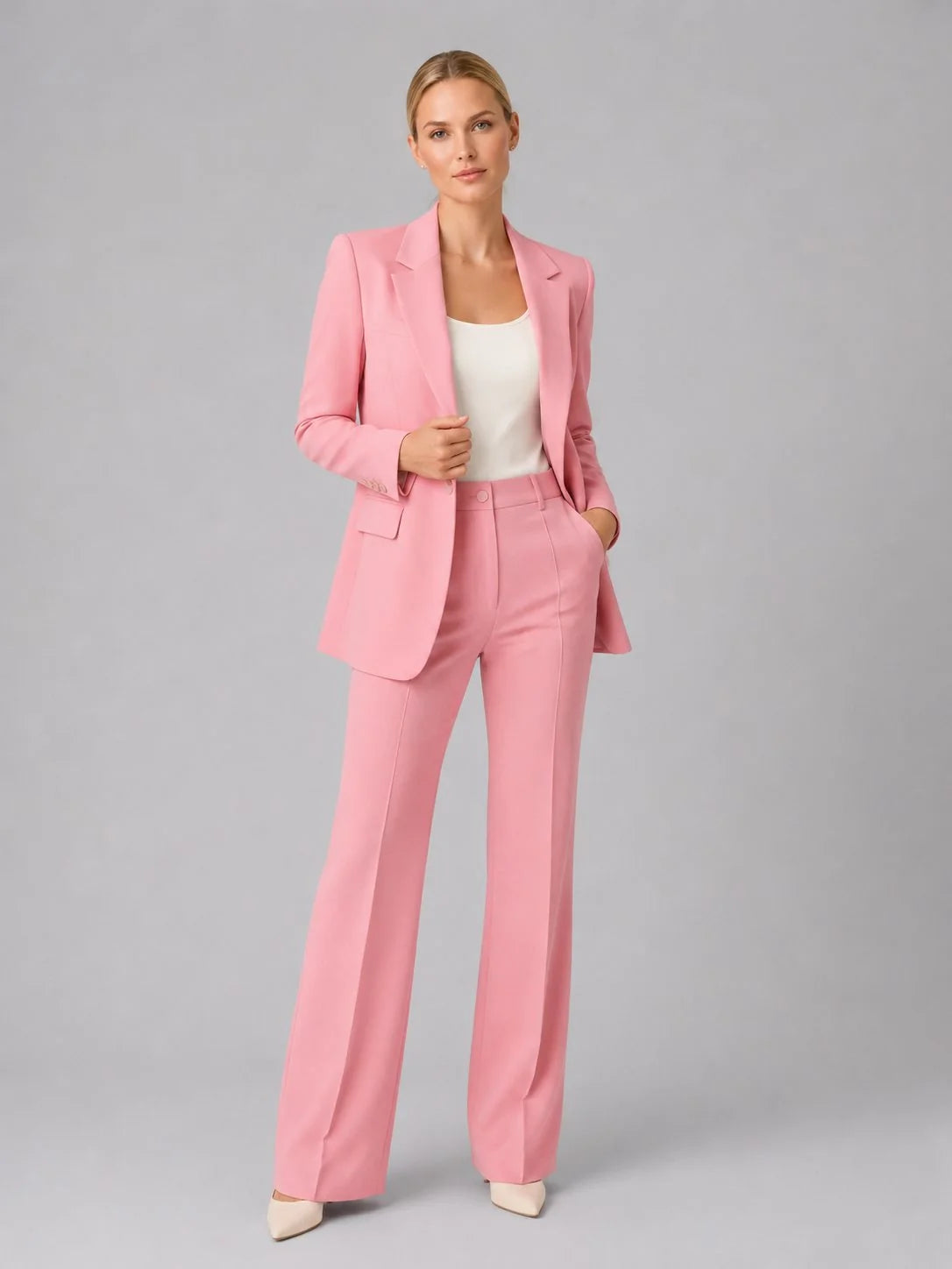 Women's tailored suit set styled for office wear with neutral heels and simple top
