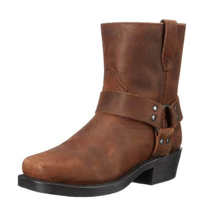 Men's harness ankle boots in brown with wraparound strap and metal stud detailing on chunky sole