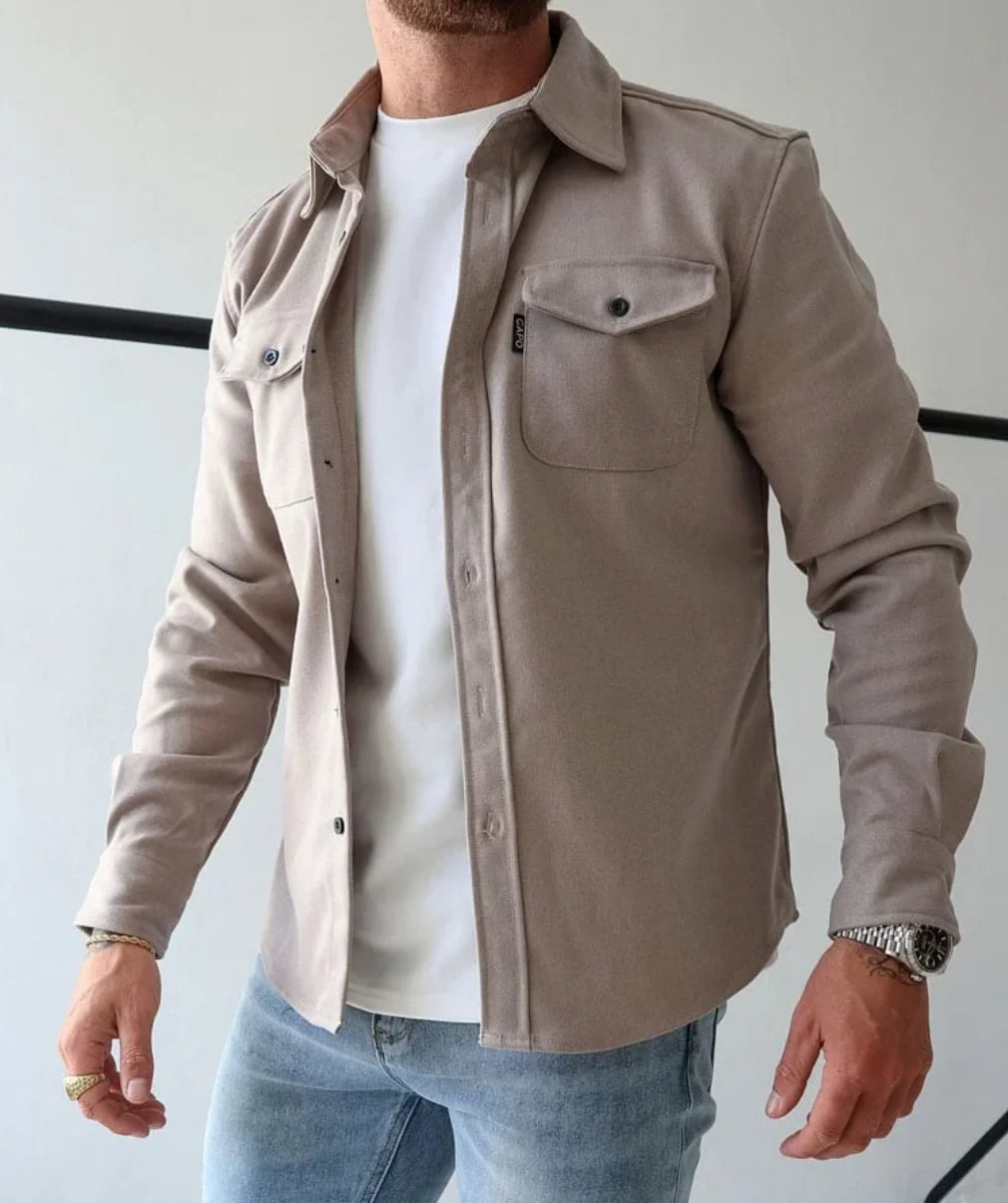 Side angle of beige overshirt jacket displaying relaxed fit and structured woven fabric