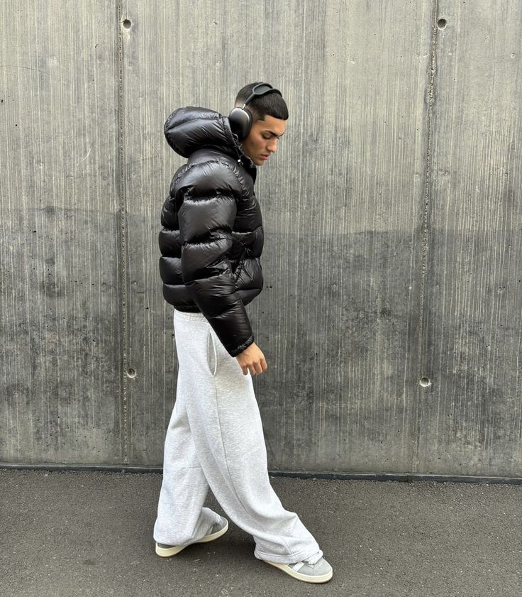 Side pocket detail on men's quilted puffer jacket with zip closure
