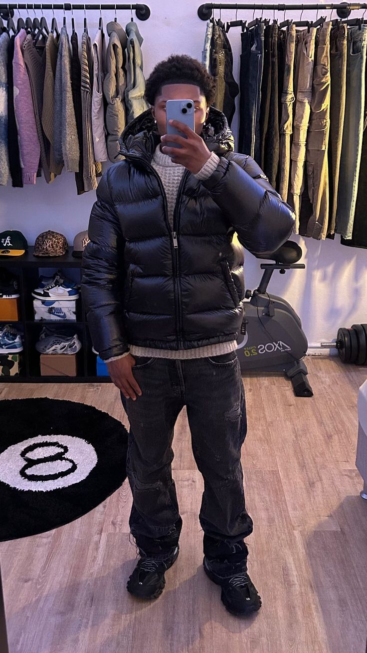 Detail of men's quilted puffer jacket construction and smooth outer fabric