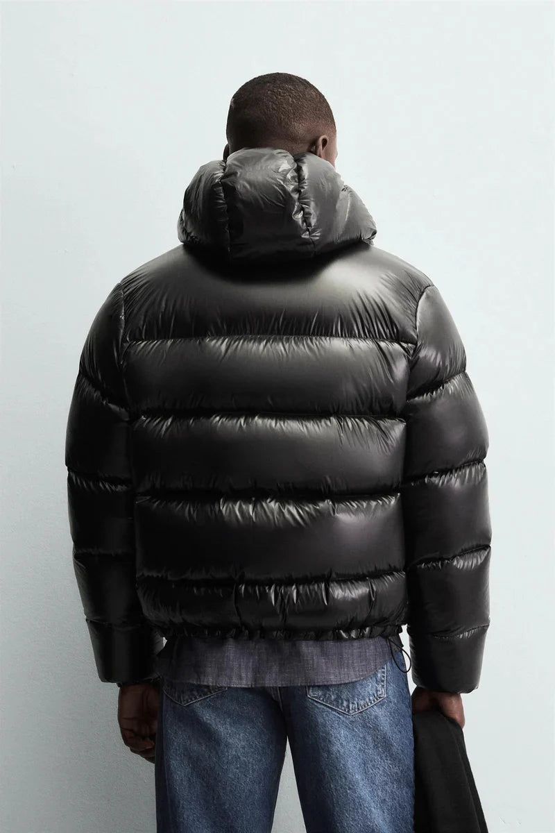 Side view of men's cropped puffer jacket with hooded neckline and relaxed fit