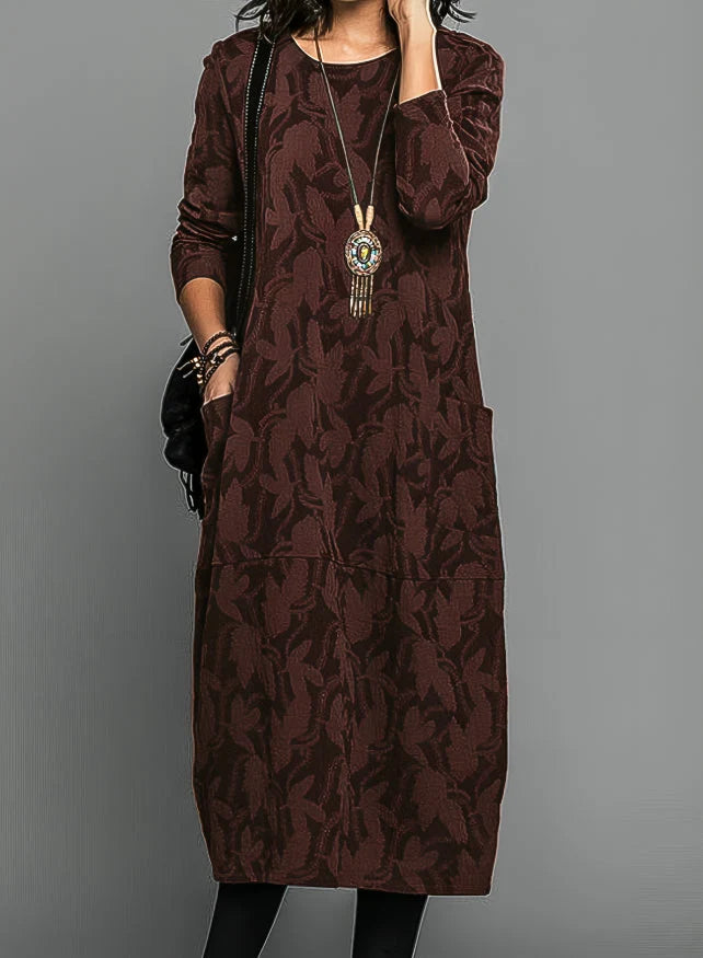 Close-up view of jacquard midi dress showing textured tonal pattern and relaxed drape