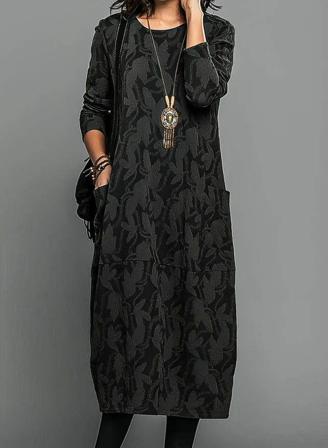 Detail shot of jacquard midi dress fabric showing woven pattern and smooth finish
