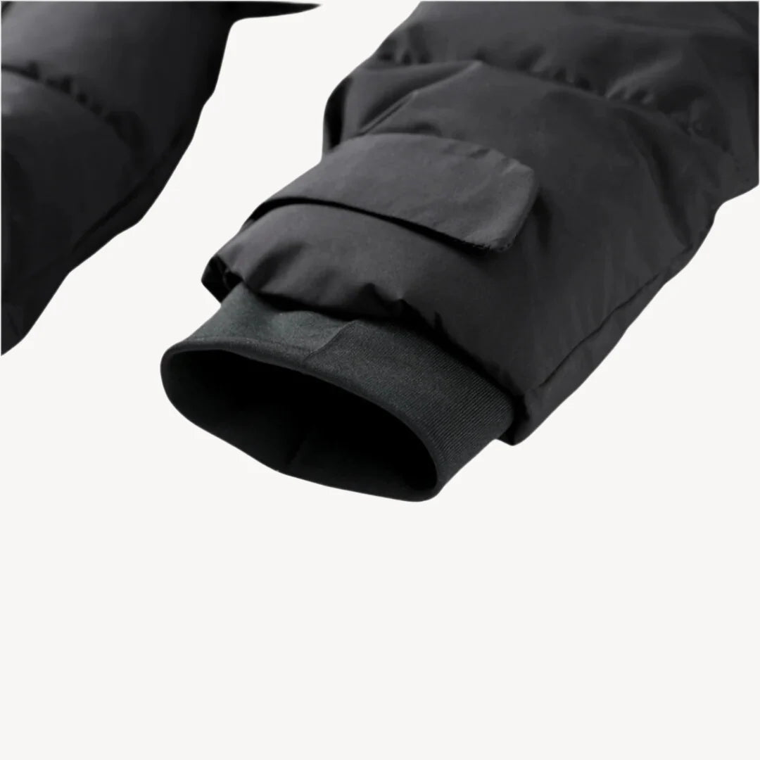 Close-up of belted puffer jacket showing funnel neck and insulated quilted construction