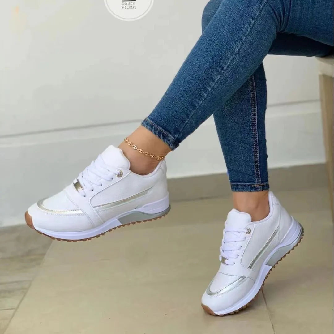Women's chunky sole trainers in white with metallic side stripe detail and lace-up closure