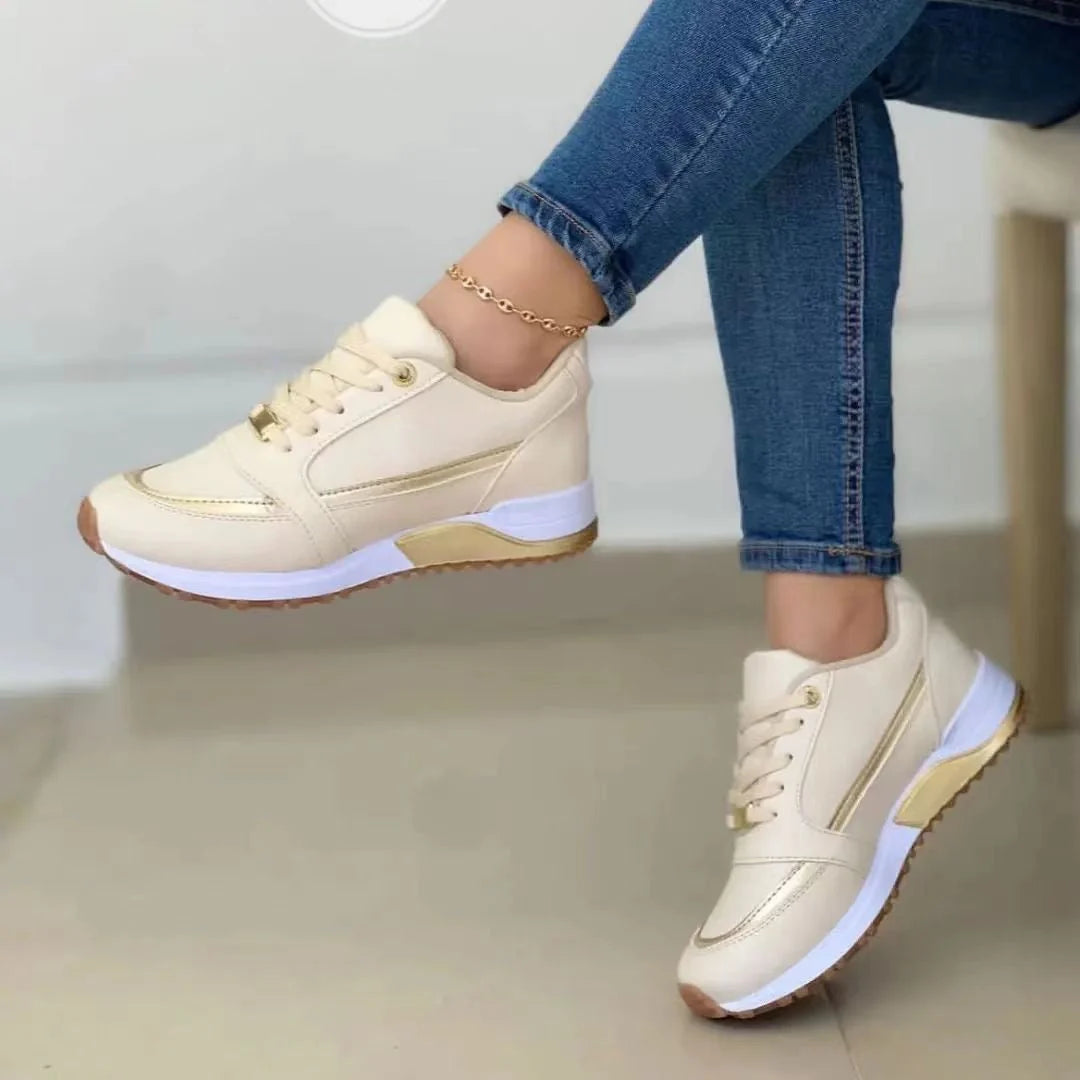 Close-up of women's platform trainers showing textured sole and structured upper construction