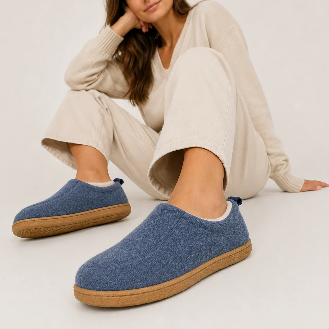 Side view of women's slip-on slippers with fleece lining and pull tab