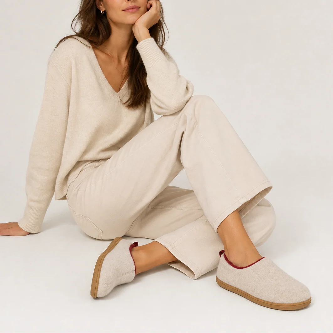 Detail of women's slipper heel tab and fleece lining for easy wear