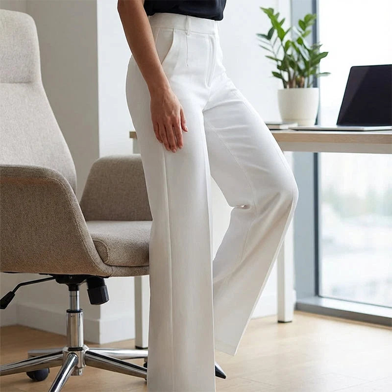 Flattering high rise fit of women's wide leg trousers at natural waist