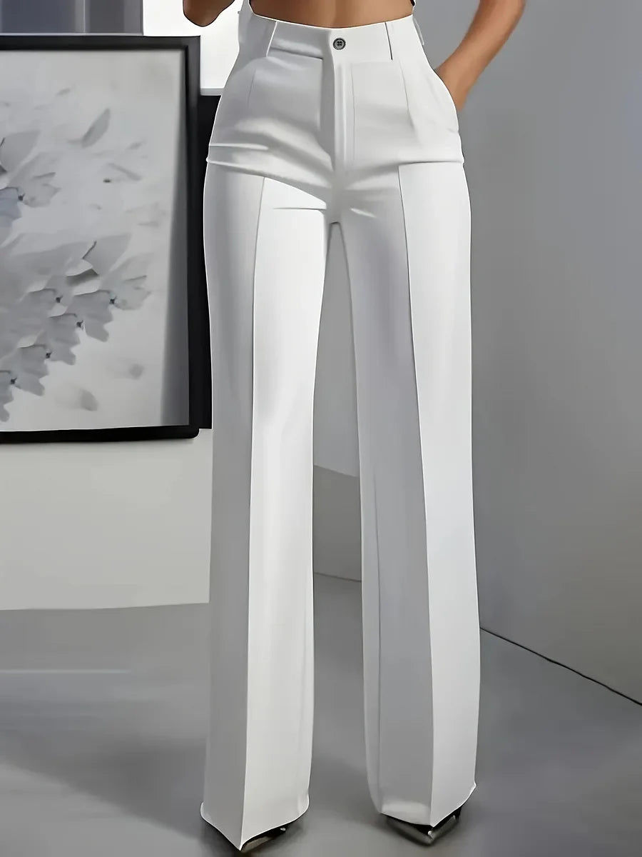 Front view of high waist wide leg trousers showing structured silhouette and clean tailoring