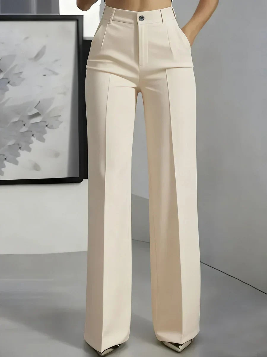 Women's tailored trousers styled for smart-casual occasions with tucked-in top