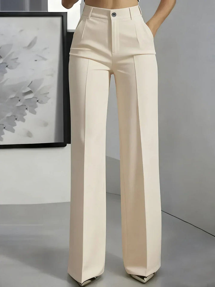 Women's tailored trousers styled for smart-casual occasions with tucked-in top