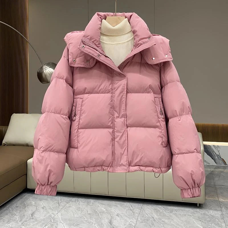 Women's hooded puffer jacket in black styled for everyday casual winter wear