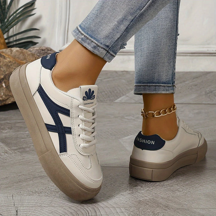 Close-up of women's platform trainers showing lace-up design and textured chunky sole