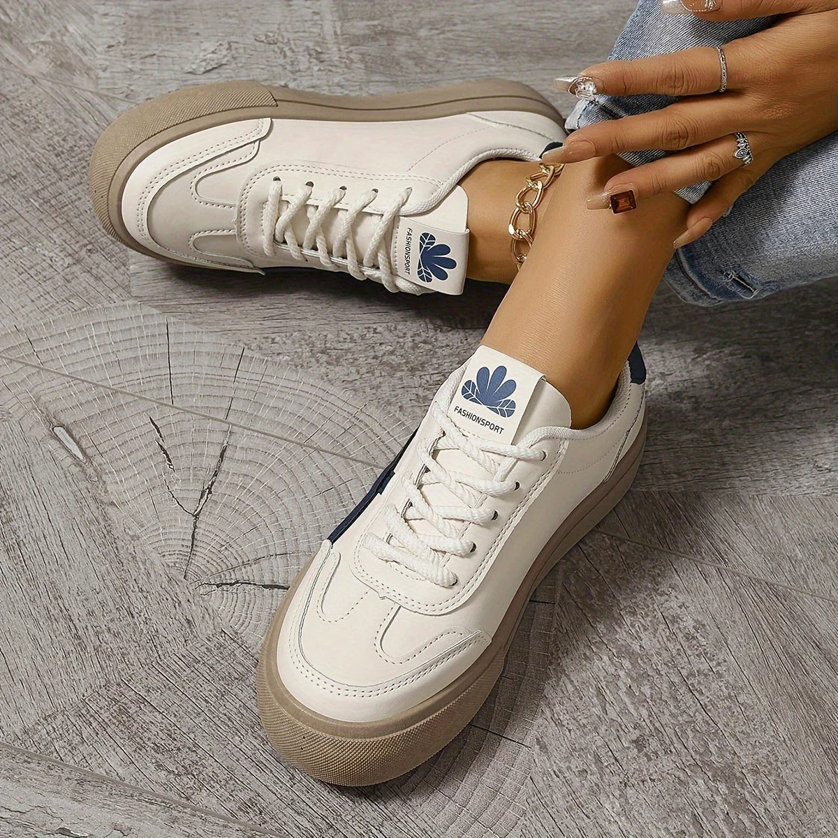Side view of women's platform trainers highlighting raised sole and contrast stripe accent
