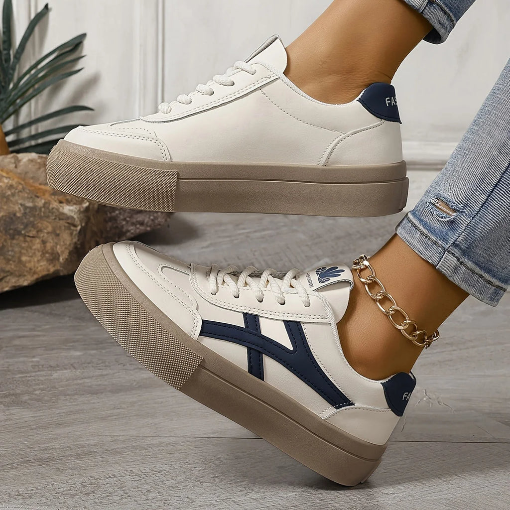 Detail of women's platform trainers showing smooth upper finish and lace-up closure