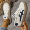 Full view of women's platform trainers showcasing chunky sole and contrast stripe design